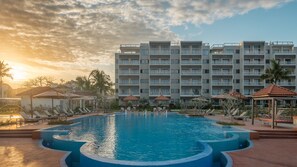 Outdoor pool, open 8 AM to 7 PM, pool umbrellas, sun loungers