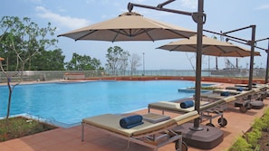 Outdoor pool, open 8 AM to 7 PM, pool umbrellas, sun loungers