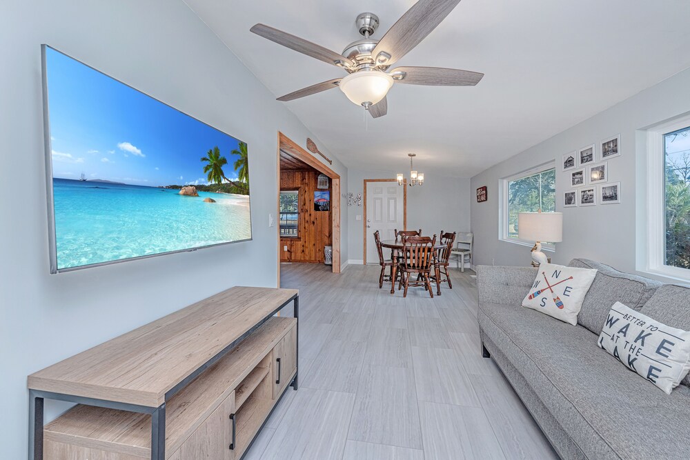 Completely renovated lake house with boat landing, dock, fire pit and