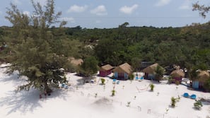 On the beach, white sand, sun-loungers, beach towels