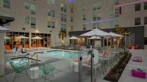 Outdoor pool, open 8 AM to 10 PM, pool umbrellas, pool loungers