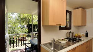 Full-sized fridge, hob, coffee/tea maker, cookware/dishes/utensils