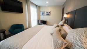 Ropa de cama de alta calidad, minibar, caja fuerte y escritorio