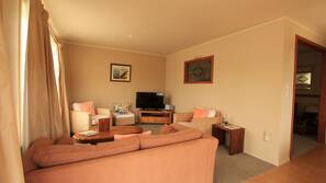 Flat-screen TV, DVD player, iPod docking station
