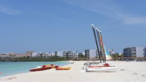 On the beach, sun-loungers