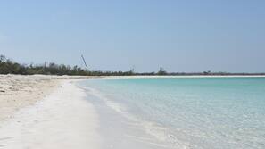 On the beach, sun-loungers