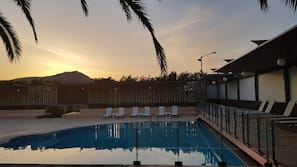 Seasonal outdoor pool, pool umbrellas, sun loungers