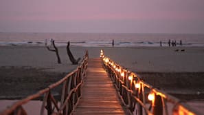 On the beach, white sand, sun-loungers, beach umbrellas
