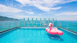 Outdoor pool, pool umbrellas, sun loungers