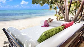 On the beach, sun loungers, beach towels