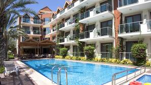 Outdoor pool, pool umbrellas, sun loungers
