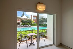Villa, 1 King Bed, Non Smoking, Balcony | Pool | 2 outdoor pools, open 7:00 AM to 7:00 PM, sun loungers