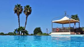 Seasonal outdoor pool, open 9:00 AM to 7:00 PM, pool umbrellas
