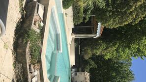 Outdoor pool, open 10:00 AM to 9:00 PM, pool loungers