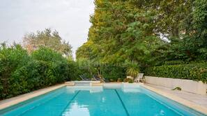 Outdoor pool, open 10:00 AM to 9:00 PM, pool loungers