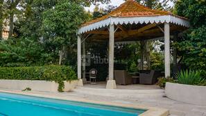 Outdoor pool, open 10:00 AM to 9:00 PM, pool loungers