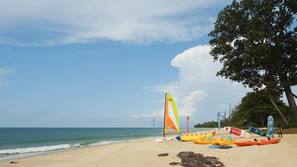 On the beach, sun-loungers, beach umbrellas, beach volleyball