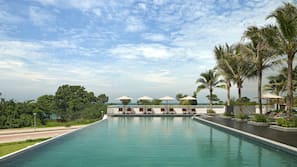 Outdoor pool, open 7:00 AM to 7:00 PM, free pool cabanas, pool umbrellas