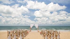 On the beach, sun-loungers, beach umbrellas, beach volleyball