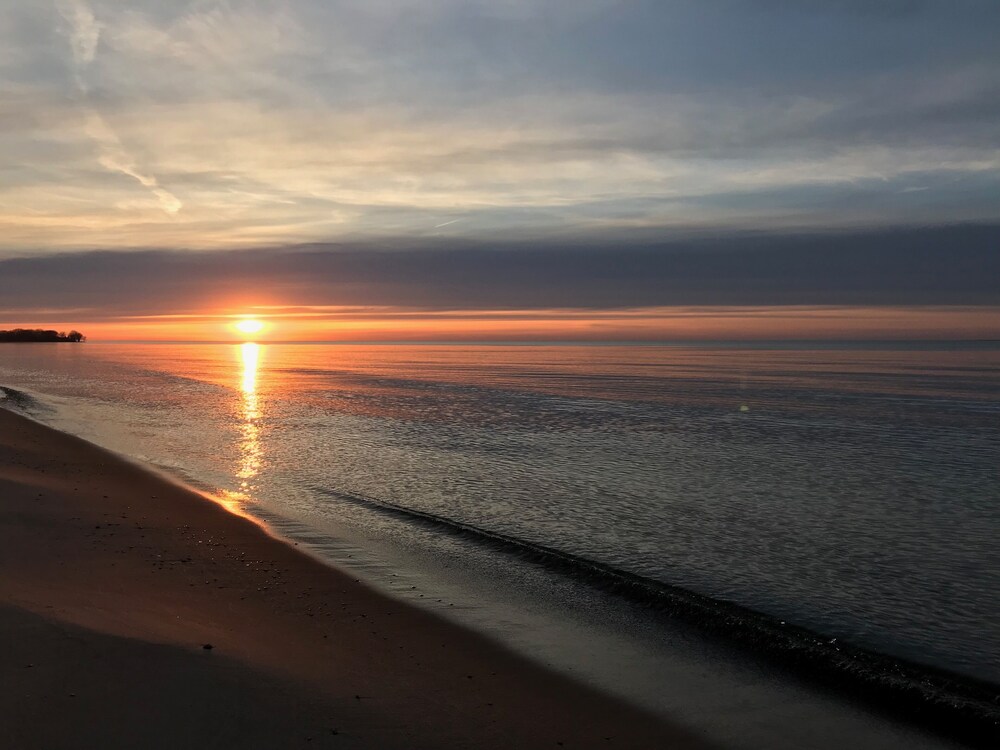 Updated Cottage with Large Deck & Private Lakefront on Caseville's Sand