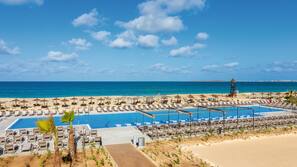 On the beach, sun loungers, beach umbrellas, snorkeling