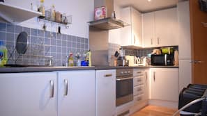 Fridge, microwave, cookware/dishes/utensils