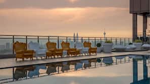 Outdoor pool, open 9:00 AM to 9:00 PM, pool loungers