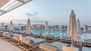 Seasonal outdoor pool, open 9 AM to 7:00 PM, free cabanas