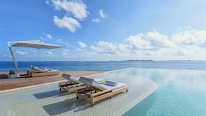 Outdoor pool, open 6 AM to 8 PM, pool umbrellas, pool loungers