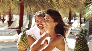 Beach nearby, white sand, beach umbrellas, beach towels
