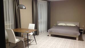 Premium bedding, desk, laptop workspace, iron/ironing board