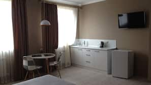 Premium bedding, desk, laptop workspace, iron/ironing board