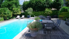 Seasonal outdoor pool, pool umbrellas, pool loungers
