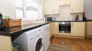 Dishwasher, coffee/tea maker, cookware/dishes/utensils