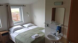 Blackout drapes, iron/ironing board, free WiFi, linens