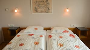 Desk, laptop workspace, blackout drapes, free cribs/infant beds