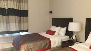 Premium bedding, memory-foam beds, desk, laptop workspace