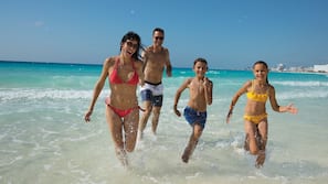 On the beach, white sand, free beach cabanas, sun loungers