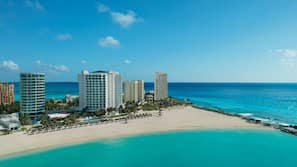 On the beach, white sand, free beach cabanas, sun loungers