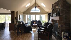 TV, fireplace, books