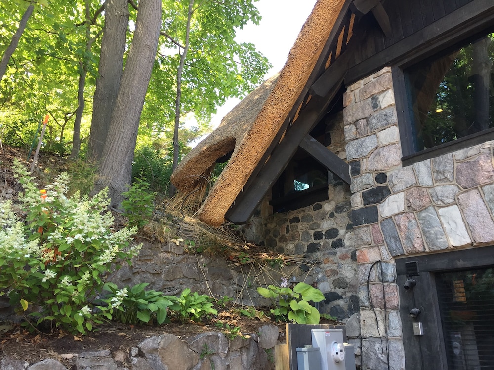 Reimagined Charlevoix Michigan Mushroom House, a thatched romantic