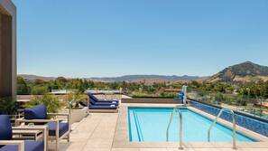 Outdoor pool, open 9:00 AM to 10:00 PM, sun loungers