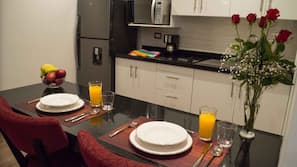 Fridge, microwave, stovetop, coffee/tea maker