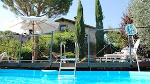 Seasonal outdoor pool, pool umbrellas, pool loungers