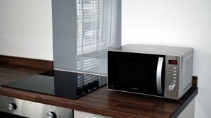 Fridge, microwave, hob, cookware/dishes/utensils