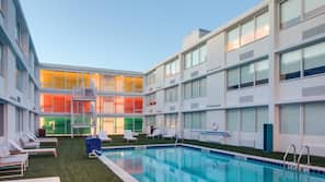 Seasonal outdoor pool, open 9:00 AM to 10:00 PM, sun loungers