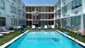 Seasonal outdoor pool, open 9:00 AM to 10:00 PM, sun loungers