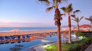 On the beach, beach umbrellas, beach towels, beach massages