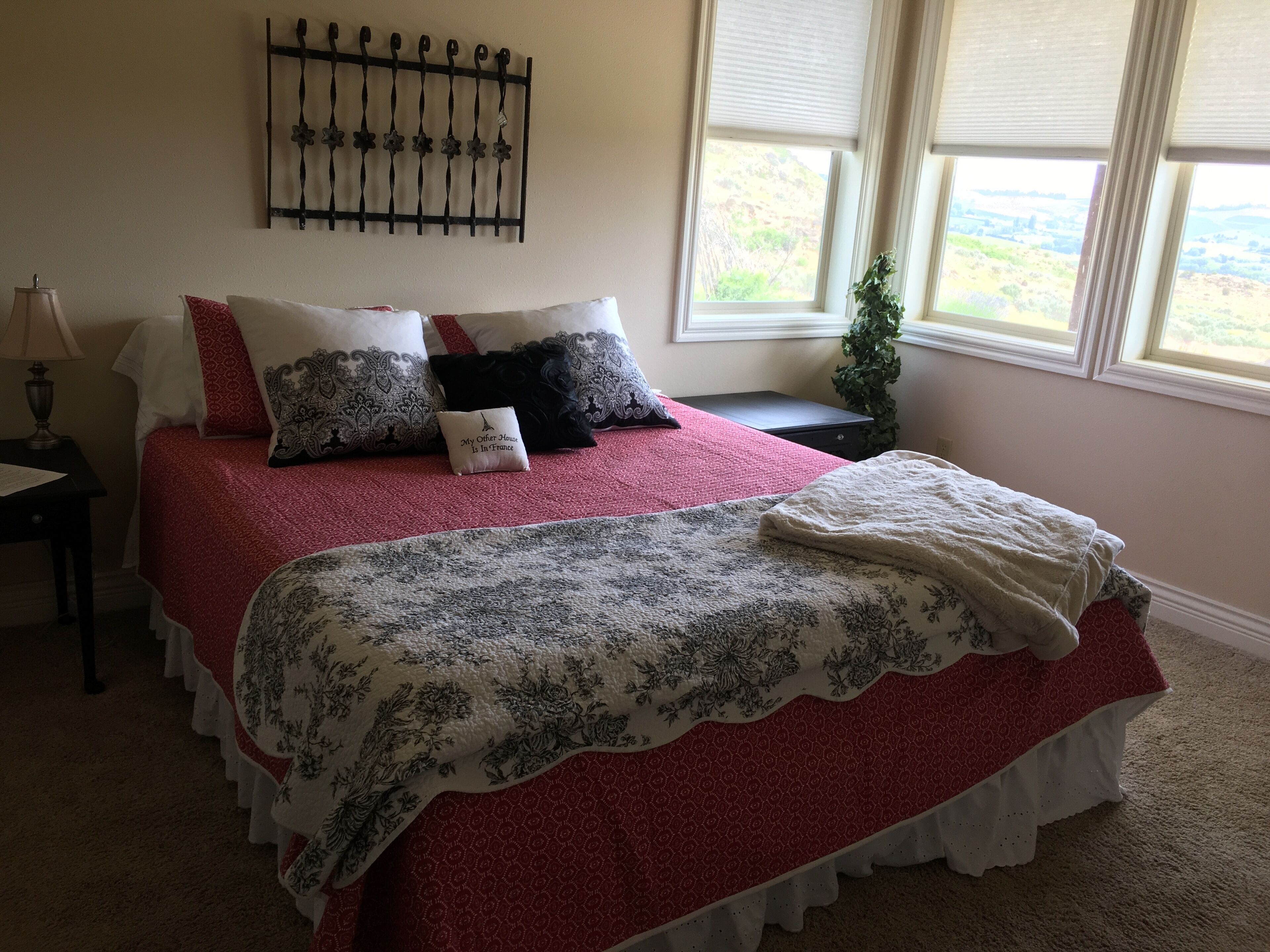 King bed in a room with a full bath in our home; a country setting with a view. in Yakima, United States