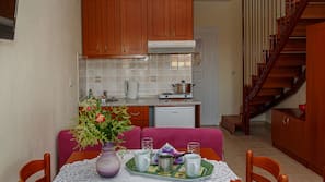 Fridge, stovetop, electric kettle, cookware/dishes/utensils